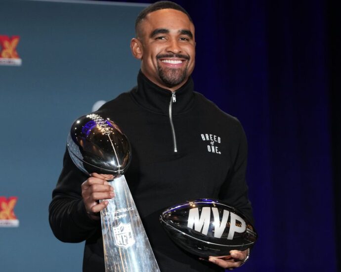 Super Bowl MVP Jalen Hurts celebrates at Disney World