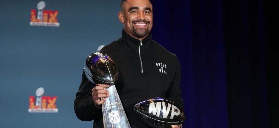 Super Bowl MVP Jalen Hurts celebrates at Disney World