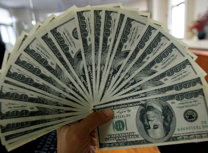 Dollar falls broadly ahead of US data, tariff uncertainty