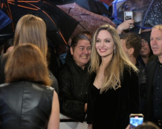 Angelina Jolie, Louis Garrel Brave Torrential Rain in San Sebastian for European Premiere of Alice Winocour’s ‘Couture’