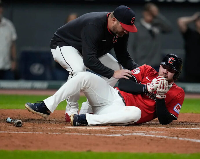 Guardians' David Fry carted off field after being hit in face by pitch while trying to bunt