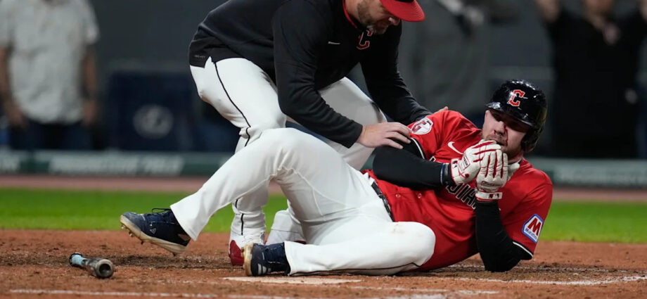 Guardians' David Fry carted off field after being hit in face by pitch while trying to bunt
