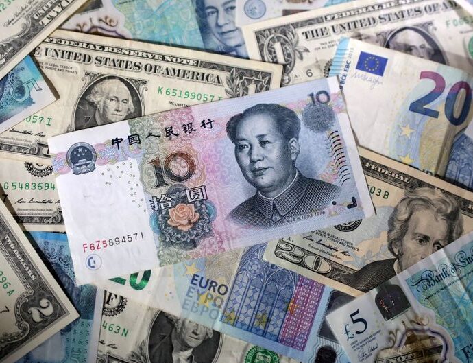 Dollar hits two-week high against yen as trade talks, Fed meeting loom