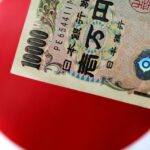 Yen wallows near record low to euro as BOJ keeps cautious tone after rate hike