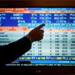 Shares jittery in Asia as metals gyrate, earnings loom
