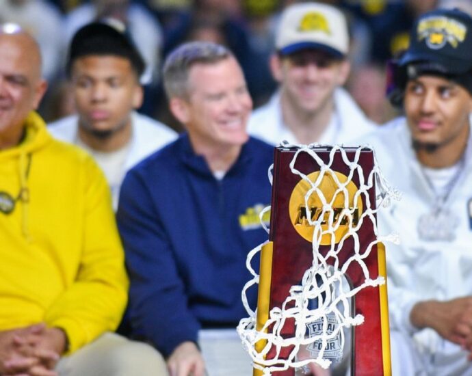 May agrees to new deal, Michigan AD Manuel says